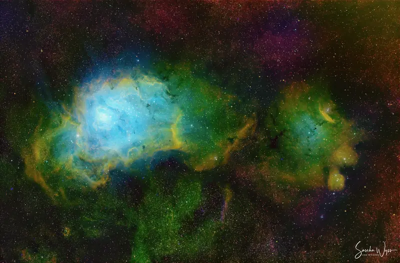The Lagoon Nebula, a broad star-forming region crossed by dark dust lanes