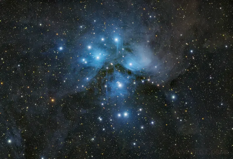 The Pleiades, a bright open cluster wrapped in blue reflection nebulosity