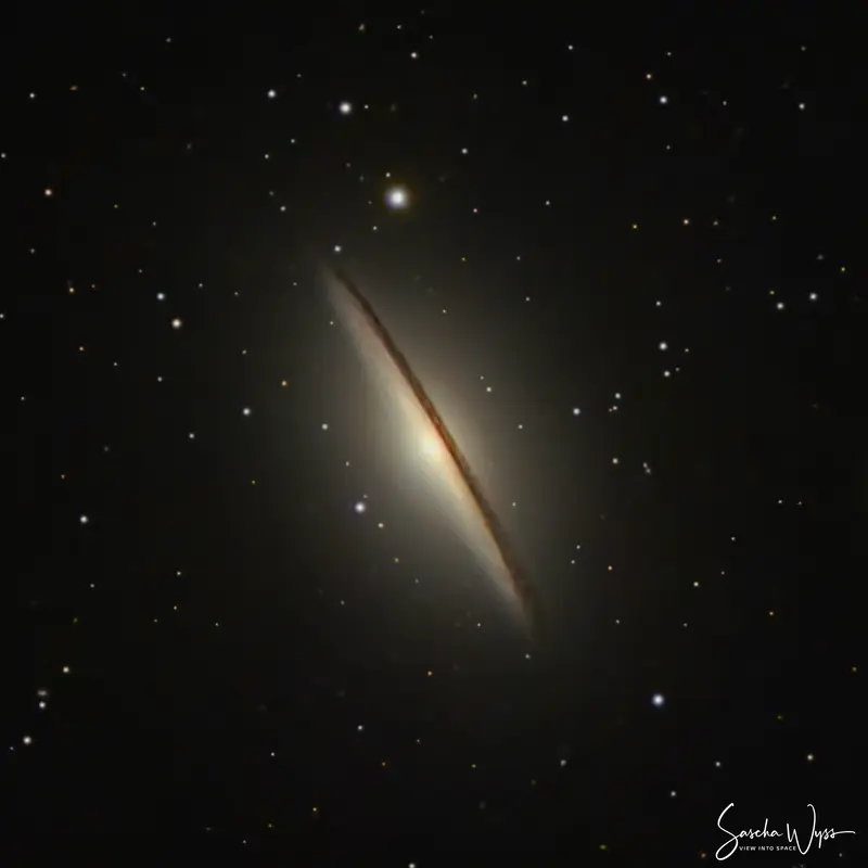 The Sombrero Galaxy, a bright core wrapped in a sharp dark dust lane